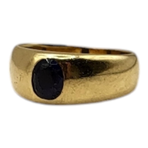 76 - A VINTAGE YELLOW METAL AND SAPPHIRE RING
The single oval cut sapphire in a rub over setting.
(size L... 