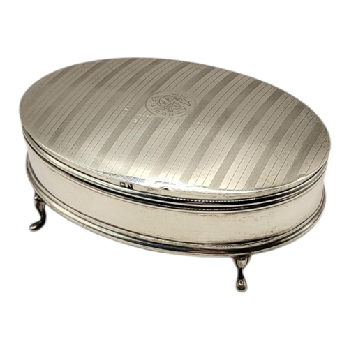 77 - AN EARLY 20TH CENTURY SILVER OVAL JEWELLERY BOX
With engraved initials, engine turned declaration an... 