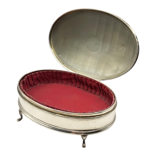 77 - AN EARLY 20TH CENTURY SILVER OVAL JEWELLERY BOX
With engraved initials, engine turned declaration an... 