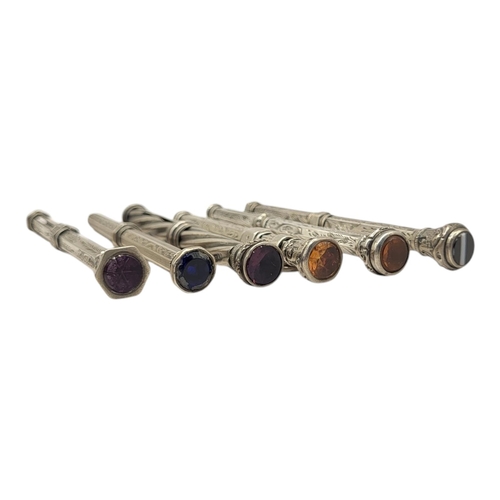 92A - A COLLECTION OF SIX VICTORIAN EARLY SILVER PROPELLING PENCILS
Two set with citrine finials and two w... 