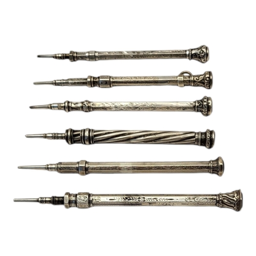 92A - A COLLECTION OF SIX VICTORIAN EARLY SILVER PROPELLING PENCILS
Two set with citrine finials and two w... 