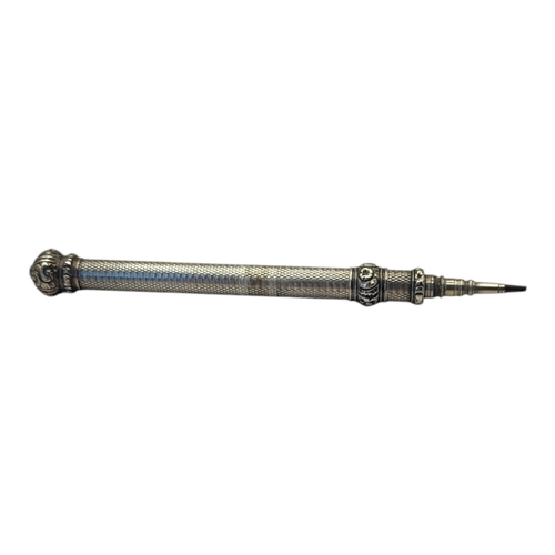 96 - A LARGE VICTORIAN WHITE METAL PROPELLING PENCIL
Having coronet finial and engine turned decoration.
... 