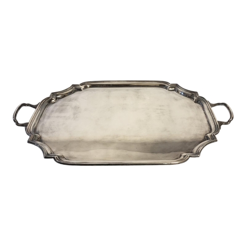 108 - A LARGE EARLY 20TH CENTURY SILVER PLATED TWIN HANDLED BUTLER'S SERVING TRAY
With a reeded piecrust b... 