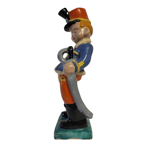 186 - KOMLOS KERAMIA BUDAPEST, AN AMUSING POLYCHROME GLAZED TERRACOTTA MODEL OF A BOY, CIRCA 1935
Wearing ... 