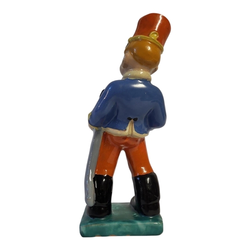 186 - KOMLOS KERAMIA BUDAPEST, AN AMUSING POLYCHROME GLAZED TERRACOTTA MODEL OF A BOY, CIRCA 1935
Wearing ... 