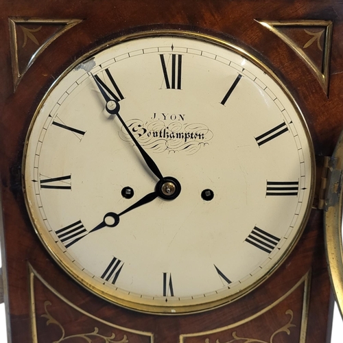 212 - J. YON, OF SOUTHAMPTON, AN EARLY 19TH CENTURY MAHOGANY AND BRASS INLAID TABLE CLOCK
The domed topped... 