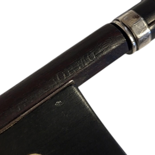 163 - A 19TH/20TH CENTURY VIOLIN BOW
The silver mounted octagonal stick, with ebony frog and mother of pea... 