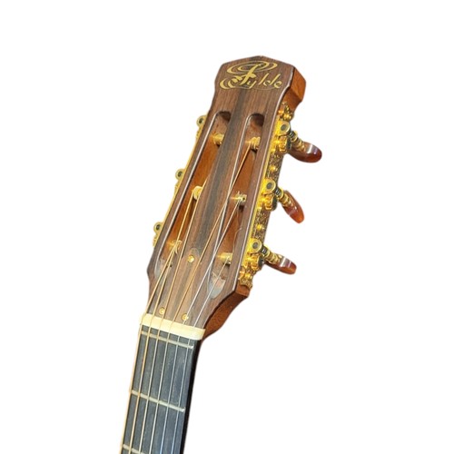 165 - FYLDE GUITARS, A VINTAGE ‘EGYPTIAN’ ELECTRIC ACOUSTIC GUITAR
Satinwood and rosewood case,gilt Fylde ... 