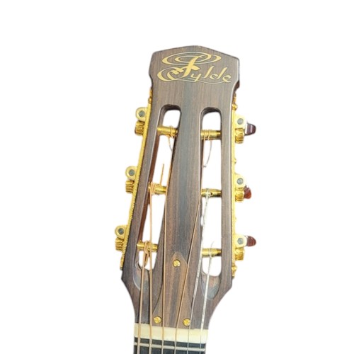 165 - FYLDE GUITARS, A VINTAGE ‘EGYPTIAN’ ELECTRIC ACOUSTIC GUITAR
Satinwood and rosewood case,gilt Fylde ... 