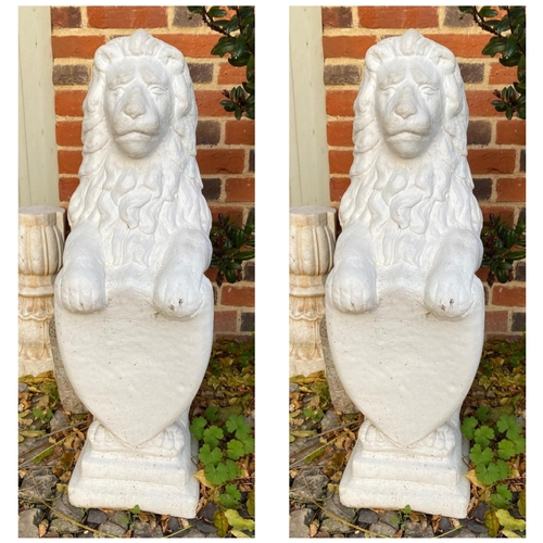 347 - A PAIR OF CAST STONE LION GARDEN STATUES
Standing pose with shield, painted white finish.
(approx 82... 