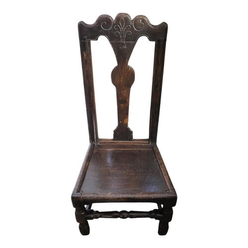 326 - AN 18TH CENTURY WELSH OAK STANDARD CHAIR
With lightly carved rail and splat, solid seat on square an... 