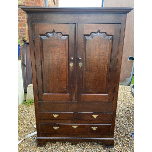 328 - A 18TH CENTURY OAK CUPBOARD OF NARROW PROPORTIONS 
With stepped cornice above two ogee panelled door... 