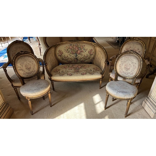 337 - AN EARLY 20TH CENTURY FRENCH CARVED GILT FRAMED FIVE PIECE SALON SUITE
Comprising two seat settee, a... 