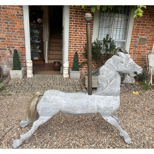 340 - A 19TH CENTURY CARVED LIME WASHED PINE CAROUSEL HORSE
Later copper poll, real hair tail.
(155cm x 16... 