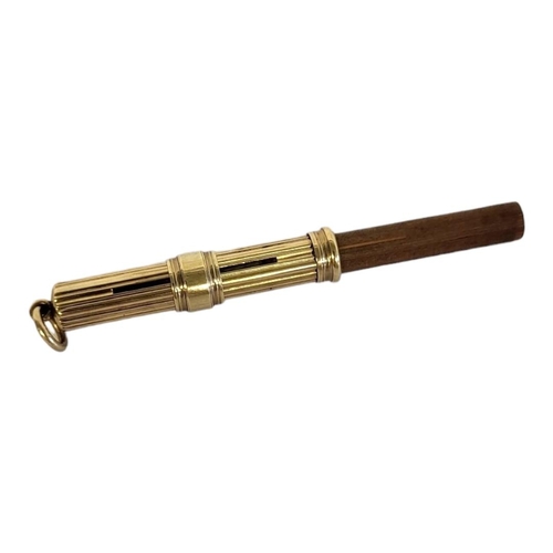 85 - A VICTORIAN 9CT GOLD PROPELLING PENCIL
Cylindrical form with reeded design and slide, complete with ... 