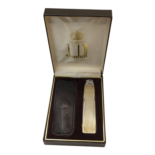 119 - ALFRED DUNHILL, A STAINLESS STEEL AND WHITE METAL PIPE TAMPER AND TOOL SET
With leather case, marked... 