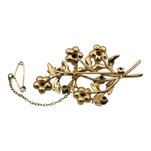 12 - A VINTAGE 9CT GOLD, TURQUOISE AND PEARL BROOCH
Having an arrangement of stones forming a floral bouq... 