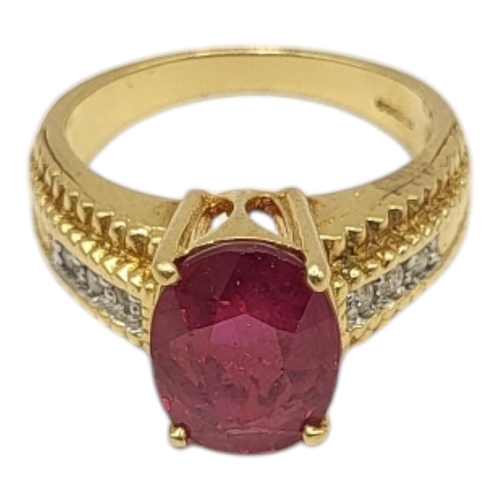 14 - A VINTAGE 18CT GOLD, RUBY AND DIAMOND RING
The single oval cut ruby with diamond set shoulders.
(rub... 