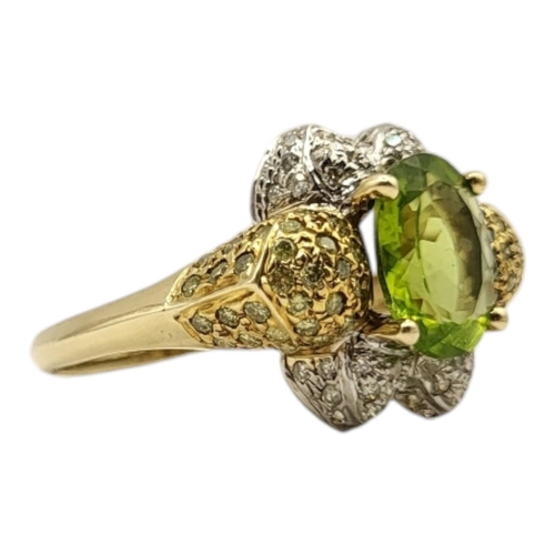 16 - A VINTAGE 14CT GOLD PERIDOT, DIAMOND AND COGNAC DIAMOND RING
The oval cut peridot set with yellow di... 