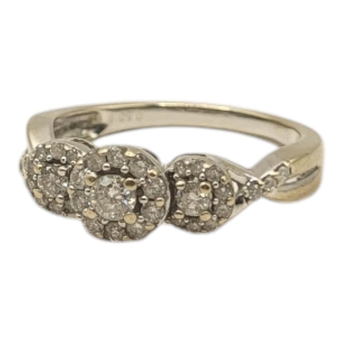 17 - A VINTAGE 18CT GOLD, DIAMOND AND YELLOW DIAMOND CLUSTER RING
Having an arrangement of three graduate... 