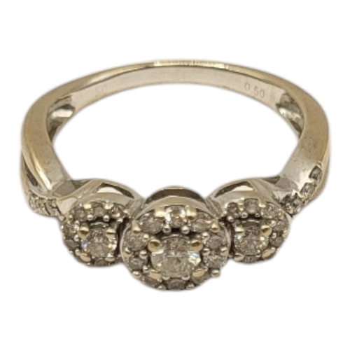 17 - A VINTAGE 18CT GOLD, DIAMOND AND YELLOW DIAMOND CLUSTER RING
Having an arrangement of three graduate... 