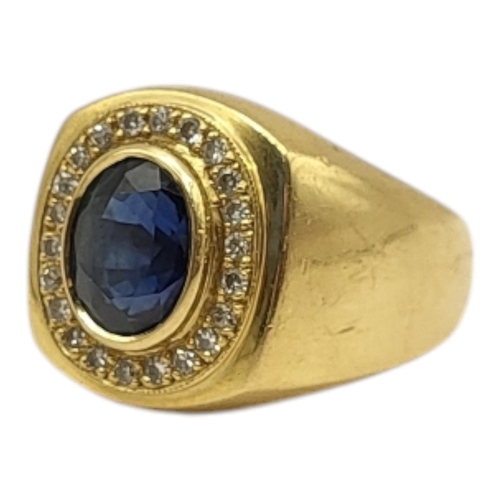 5 - A VINTAGE 18CT GOLD, SAPPHIRE AND DIAMOND SIGNET RING
The central oval cut sapphire edged with diamo... 