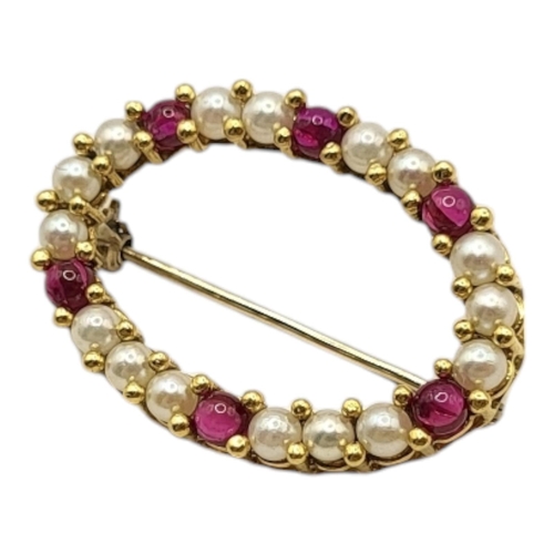 9 - A VINTAGE 18CT GOLD, RUBY AND SEED PEARL BROOCH
The row of seed pearls interspersed with rubies.
(ap... 