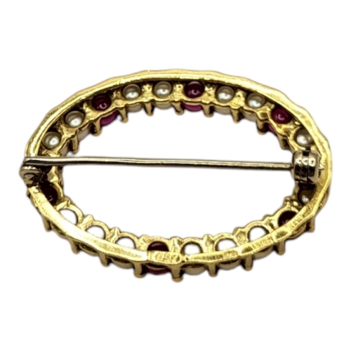 9 - A VINTAGE 18CT GOLD, RUBY AND SEED PEARL BROOCH
The row of seed pearls interspersed with rubies.
(ap... 