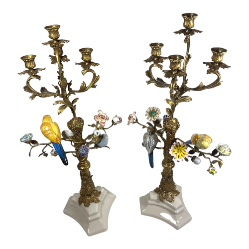 247 - A PAIR OF CONTINENTAL STYLE PORCELAIN AND GILT BRONZE CANDELABRA
Four sconces supported by scrolling... 