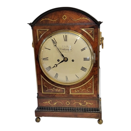 253 - J. YON, OF SOUTHAMPTON, AN EARLY 19TH CENTURY MAHOGANY AND BRASS INLAID TABLE CLOCK
The domed topped... 