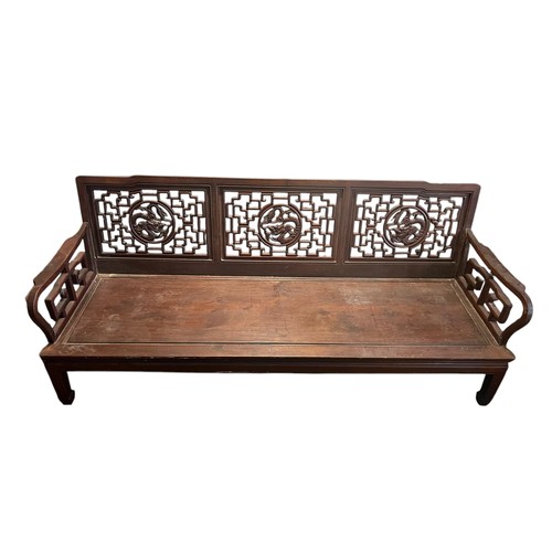 272 - A CHINESE CARVED HARDWOOD BENCH
With dragon motifs to back panels.
(183cm x 59cm x 75cm)

Condition:... 