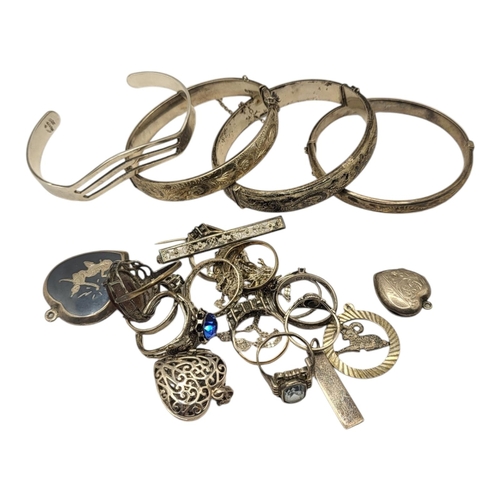 293 - A COLLECTION OF VINTAGE SILVER BANGLES
To include a Mexican bangle with pierced decoration, together... 