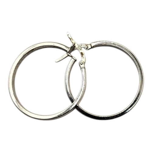 294 - A PAIR OF VINTAGE 9ct WHITE METAL HOOP EARRINGS
Plain form.
(approx 3cm)

Condition: good overall