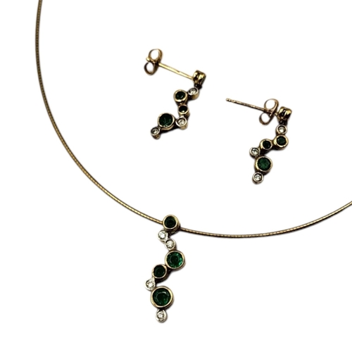 3 - A VINTAGE 9CT GOLD EMERALD PENDANT NECKLACE AND EARRINGS SET
Graduated round cut emeralds interspers... 