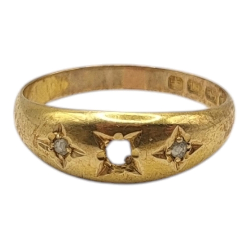 300 - AN EARLY 20TH CENTURY 18CT GOLD RING
Set with three stones, marked for Birmingham.
(size P)

Conditi... 