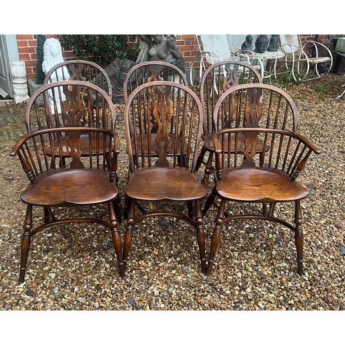 305 - A SET OF SIX OAK TITCHMARSH & GOODWIN WINDSOR DINING CHAIRS
Including two carvers, having pierced sp... 