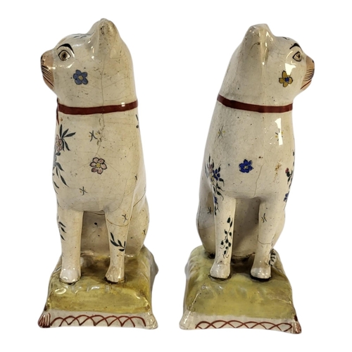 352 - A PAIR OF VICTORIAN POTTERY CAT FIGURES
Seated pose with floral decoration and cushion to base.
(app... 