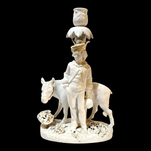 360 - A 19TH CENTURY GERMAN BLANC DE CHINE PORCELAIN FIGURAL CANDLESTICK
Young gent with donkey, underglaz... 