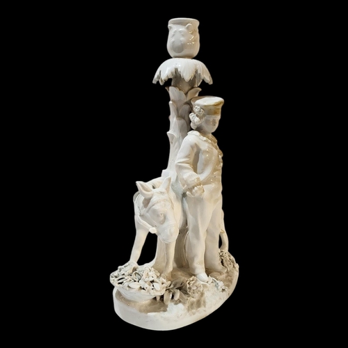 360 - A 19TH CENTURY GERMAN BLANC DE CHINE PORCELAIN FIGURAL CANDLESTICK
Young gent with donkey, underglaz... 