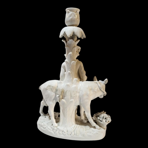 360 - A 19TH CENTURY GERMAN BLANC DE CHINE PORCELAIN FIGURAL CANDLESTICK
Young gent with donkey, underglaz... 