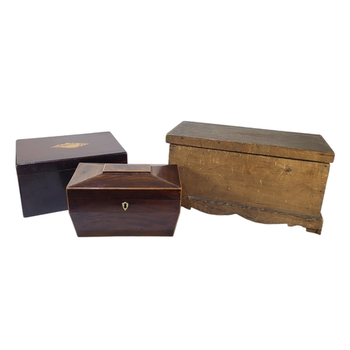 393 - A 19TH CENTURY MAHOGANY TEA CADDY
Sarcophagus form with inlaid stringing and two fitted compartments... 