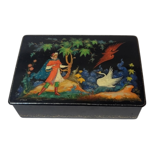 415 - A MID 20TH CENTURY RUSSIAN LACQUER CIGARETTE BOX
Rectangular form with hand painted mythological sce... 