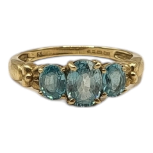 7 - A VINTAGE 9CT GOLD AND AQUAMARINE THREE STONE RING
Graduated round cut stones with cruciform design ... 