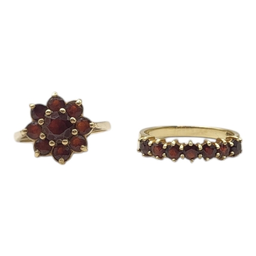 8 - A CONTINENTAL 14CT GOLD AND GARNET HALF ETERNITY RING
Having an arrangement of round cut stones in a... 