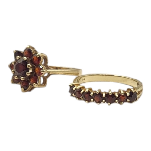 8 - A CONTINENTAL 14CT GOLD AND GARNET HALF ETERNITY RING
Having an arrangement of round cut stones in a... 