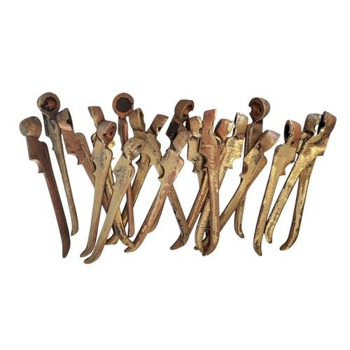 339 - A COLLECTION OF TEN SOLID CAST BRASS BULLET MOULDS
Twin handles and shallow bowl.
(approx 15cm, appr... 