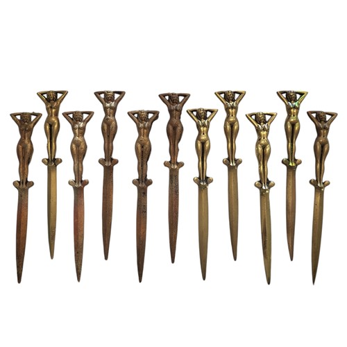 423 - A COLLECTION OF TEN ART DECO DESIGN SOLID CAST BRASS FIGURAL LETTER OPENERS
With nude female finials... 