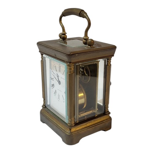 375 - AN ELLIOT & SONS OF LONDON, A BRASS MOUNTED MINIATURE CARRIAGE CLOCK/TIMEPIECE, CIRCA 1900
White ena... 