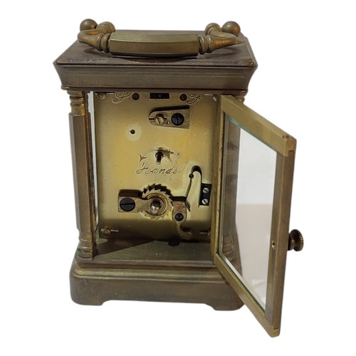 375 - AN ELLIOT & SONS OF LONDON, A BRASS MOUNTED MINIATURE CARRIAGE CLOCK/TIMEPIECE, CIRCA 1900
White ena... 