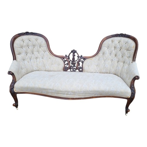 401 - A VICTORIAN MAHOGANY DOUBLE SPOON BACK SETTEE
With pierced fretwork central panel, button back fabri... 